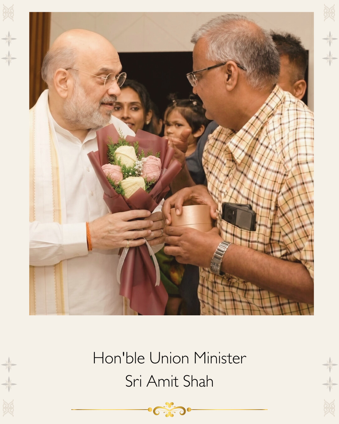 Hon'ble Union Minister Sri Amit Shah felicitated with a White Flowerr Vastra Maala